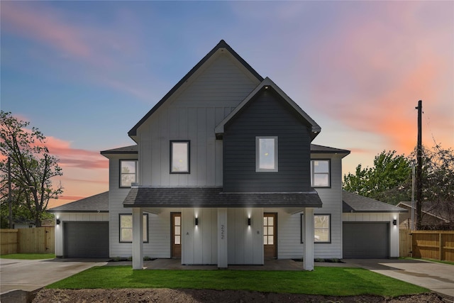 222 Canino Rd A/B, Unit A/B Houston, TX 77076 - modern farmhouse style home with board and batten siding, covered porch, a shingled roof, and concrete driveway