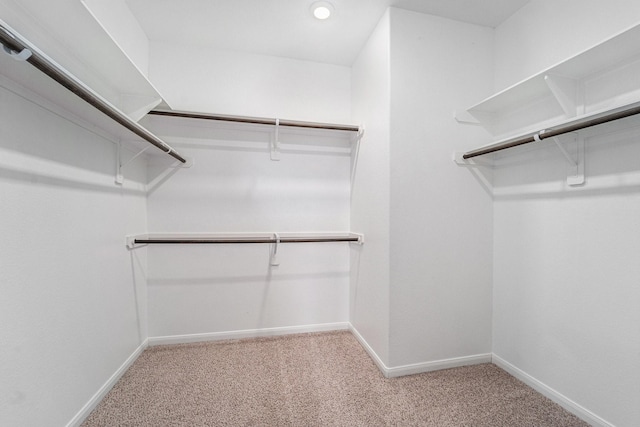 7714 Squall Ln, Baytown, TX 77523 - spacious closet featuring carpet floors