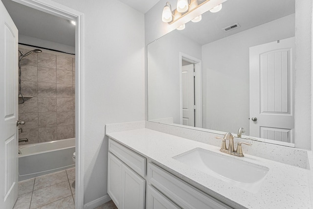 7714 Squall Ln, Baytown, TX 77523 - bathroom featuring toilet, vanity, tile patterned flooring, bathtub / shower combination, and baseboards