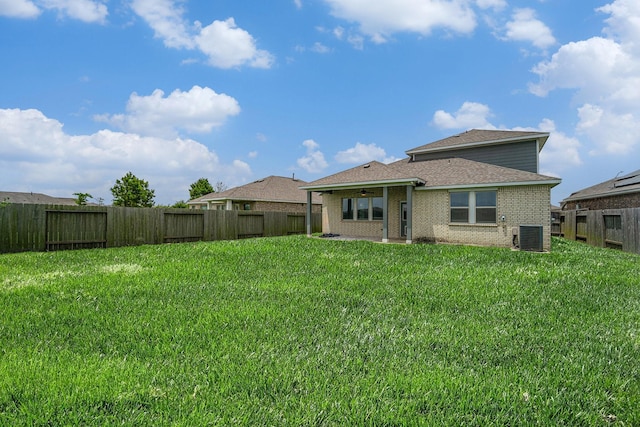 7714 Squall Ln, Baytown, TX 77523 - rear view of house with central AC unit, brick siding, a patio, ceiling fan, and roof with shingles