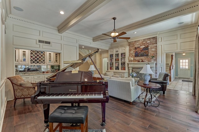 5211 Rothchilde Ct, Houston, TX 77069 - sitting room featuring stairs, beam ceiling, a decorative wall, ceiling fan, and wood finished floors
