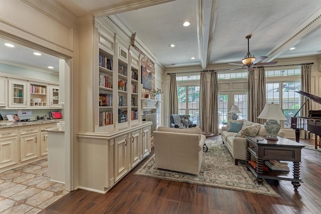 5211 Rothchilde Ct, Houston, TX 77069 - sitting room featuring ornamental molding, dark wood-style floors, a ceiling fan, a fireplace, and plenty of natural light
