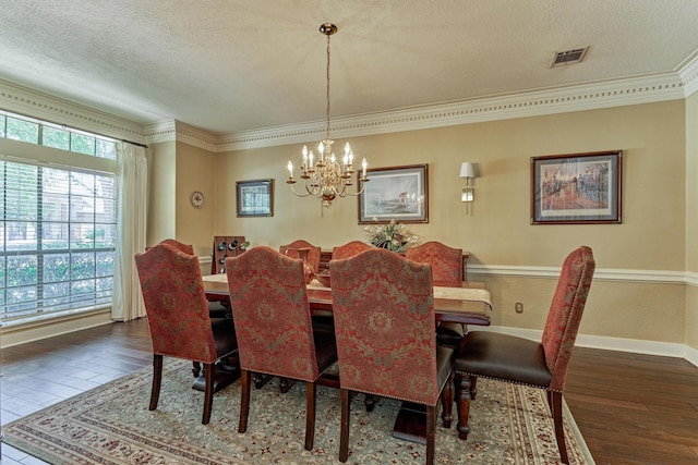 5211 Rothchilde Ct, Houston, TX 77069 - dining space featuring hardwood / wood-style flooring, a chandelier, crown molding, a textured ceiling, and baseboards