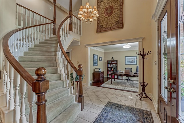 5211 Rothchilde Ct, Houston, TX 77069 - entryway with a high ceiling, baseboards, crown molding, light tile patterned flooring, and stairs