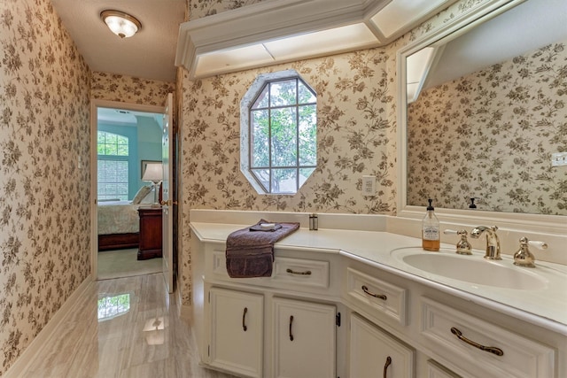 5211 Rothchilde Ct, Houston, TX 77069 - ensuite bathroom with plenty of natural light, vanity, and wallpapered walls
