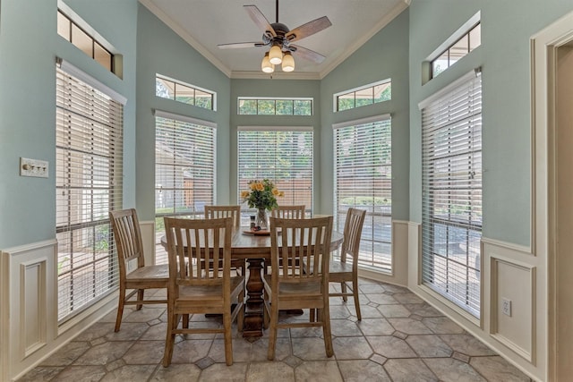 5211 Rothchilde Ct, Houston, TX 77069 - dining area featuring ornamental molding, plenty of natural light, a ceiling fan, high vaulted ceiling, and wainscoting