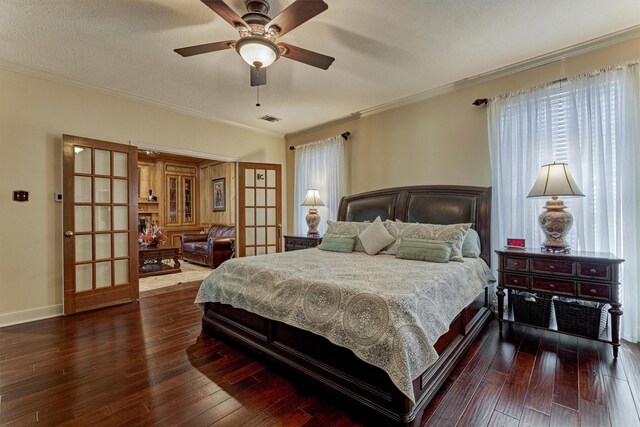 5211 Rothchilde Ct, Houston, TX 77069 - bedroom with wood-type flooring, crown molding, baseboards, and french doors