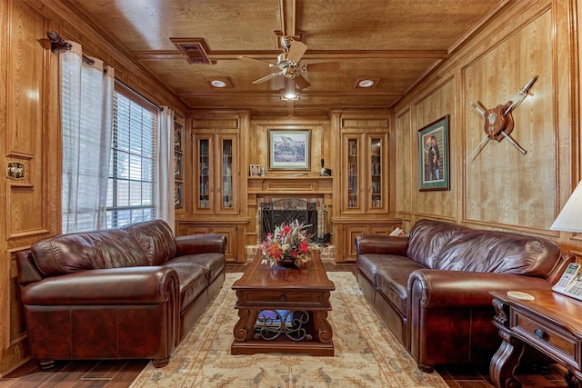 5211 Rothchilde Ct, Houston, TX 77069 - living area with wooden ceiling, wooden walls, ceiling fan, a fireplace with raised hearth, and wood finished floors
