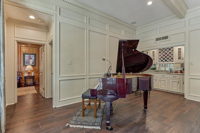 5211 Rothchilde Ct, Houston, TX 77069 - sitting room with a decorative wall, wet bar, beam ceiling, dark wood finished floors, and ornamental molding