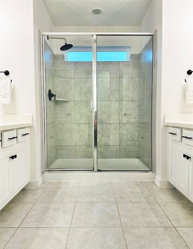 12531 Hilltop Mill Rd, Magnolia, TX 77354 - bathroom with vanity, a shower stall, tile patterned floors, and baseboards