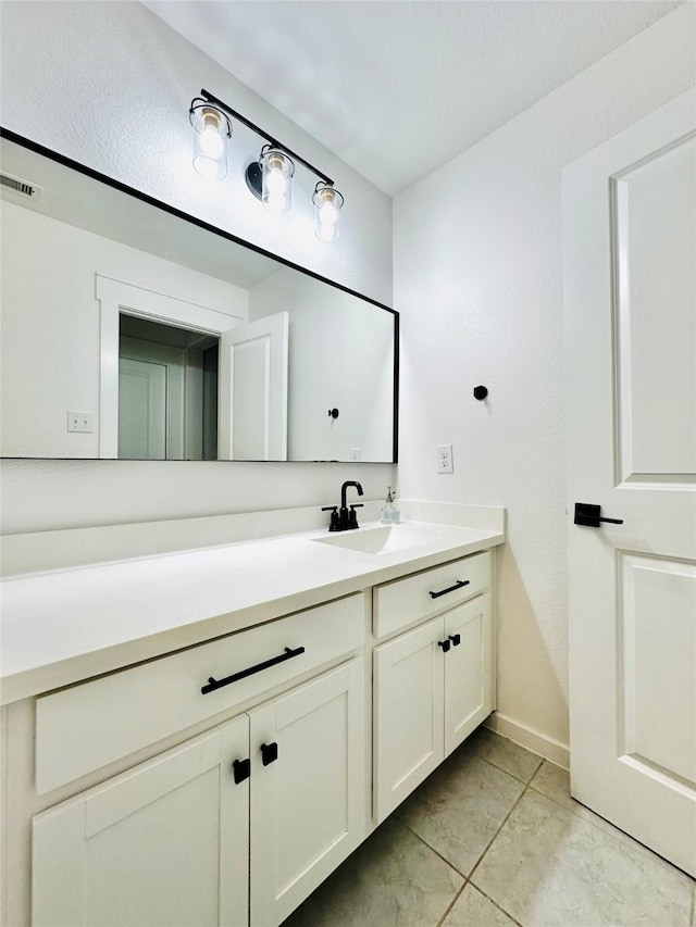 12531 Hilltop Mill Rd, Magnolia, TX 77354 - bathroom featuring vanity, baseboards, and tile patterned flooring
