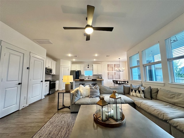 12531 Hilltop Mill Rd, Magnolia, TX 77354 - living area with a chandelier, dark wood-type flooring, ceiling fan, and recessed lighting