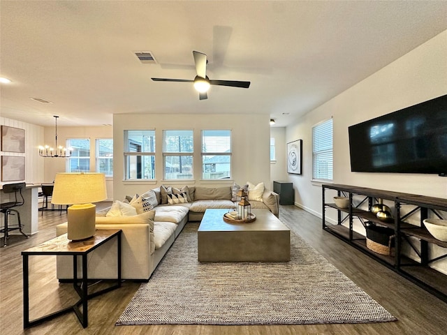 12531 Hilltop Mill Rd, Magnolia, TX 77354 - living room with wood finished floors, a chandelier, plenty of natural light, and a ceiling fan