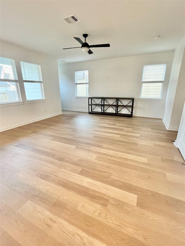 12531 Hilltop Mill Rd, Magnolia, TX 77354 - spare room featuring light wood-style flooring, baseboards, and ceiling fan