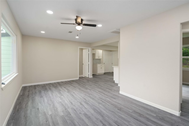9409 Fairland Dr, Houston, TX 77051 - unfurnished living room featuring a ceiling fan, wood finished floors, plenty of natural light, and recessed lighting