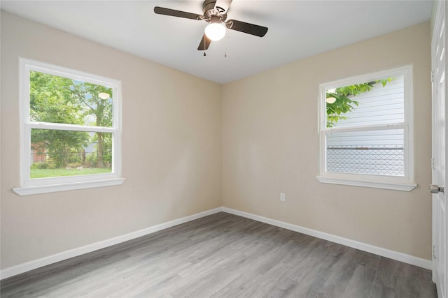 9409 Fairland Dr, Houston, TX 77051 - empty room with wood finished floors, baseboards, and ceiling fan