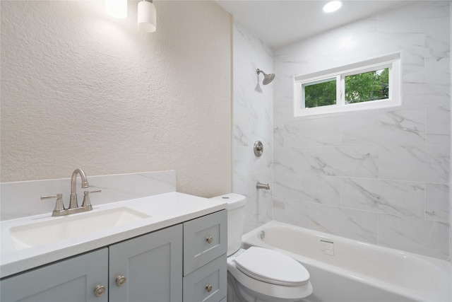 9409 Fairland Dr, Houston, TX 77051 - bathroom with vanity, a textured wall, toilet, and washtub / shower combination