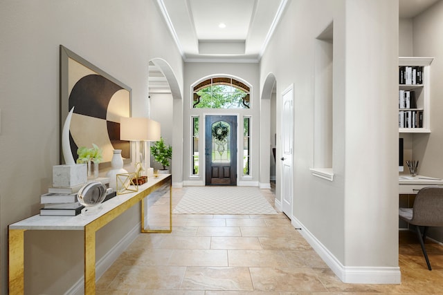 13909 Morgan Bay Dr, Pearland, TX 77584 - entrance foyer featuring arched walkways, a towering ceiling, baseboards, and ornamental molding