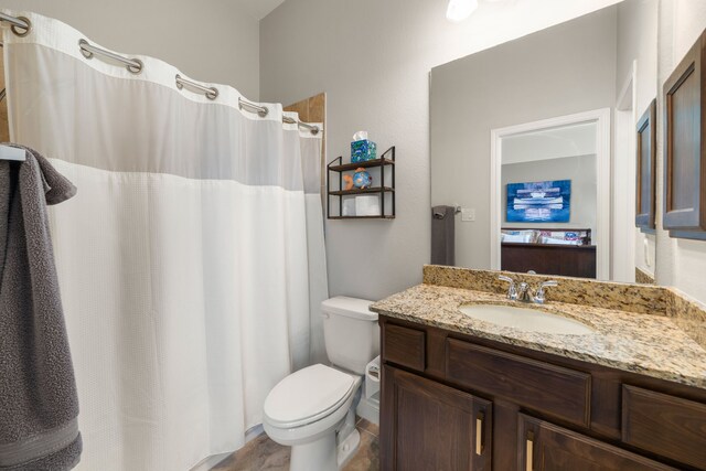 13909 Morgan Bay Dr, Pearland, TX 77584 - full bathroom with vanity, toilet, and a shower with shower curtain