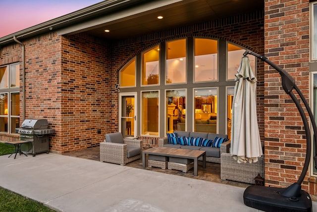 13909 Morgan Bay Dr, Pearland, TX 77584 - patio terrace at dusk featuring grilling area, an outdoor living space, and a patio