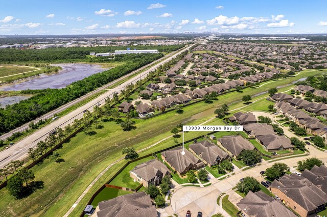 13909 Morgan Bay Dr, Pearland, TX 77584 - aerial view of property's location with nearby suburban area and a large body of water