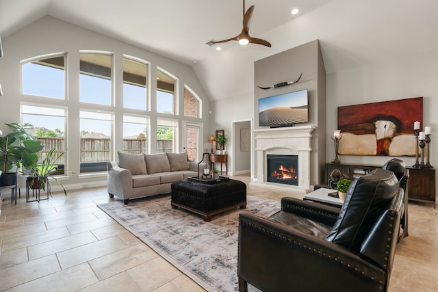 13909 Morgan Bay Dr, Pearland, TX 77584 - living area with ceiling fan, a lit fireplace, high vaulted ceiling, recessed lighting, and light tile patterned floors