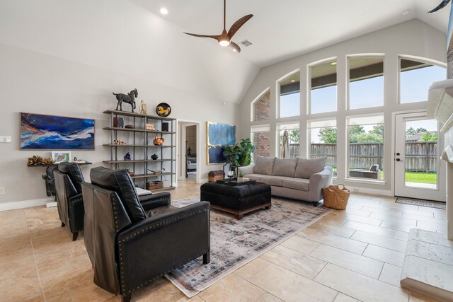13909 Morgan Bay Dr, Pearland, TX 77584 - living room featuring a ceiling fan, recessed lighting, high vaulted ceiling, light tile patterned flooring, and baseboards