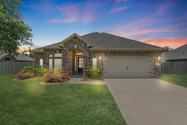 1290 Laurel Loop, Angleton, TX 77515 - french country style house featuring brick siding, a shingled roof, concrete driveway, and an attached garage