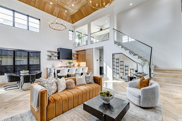 1030 Voight St, Houston, TX 77009 - living room with a chandelier, stairs, a towering ceiling, wooden ceiling, and recessed lighting
