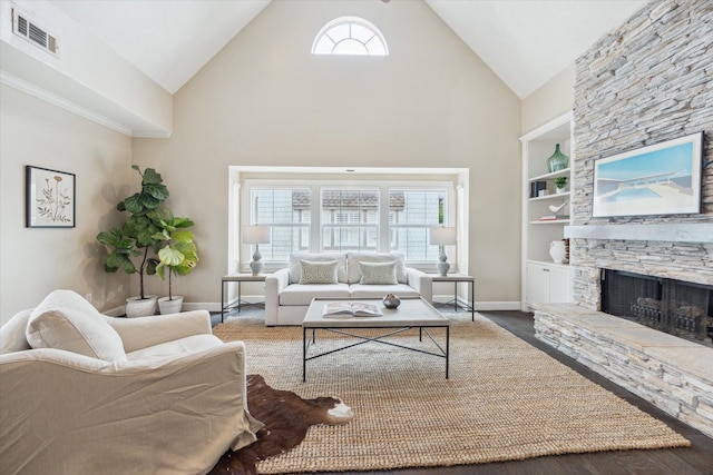 2409 Ralph St Unit A, Houston, TX 77006 - living room featuring high vaulted ceiling, built in features, baseboards, healthy amount of natural light, and a fireplace