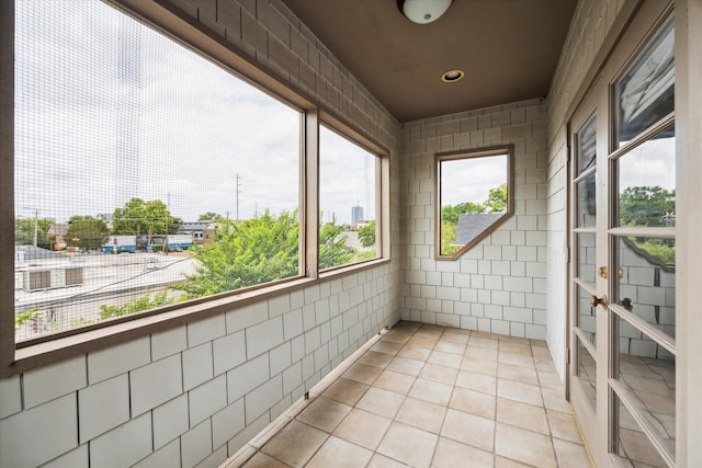 2409 Ralph St Unit A, Houston, TX 77006 - unfurnished sunroom featuring tile walls and tile patterned floors