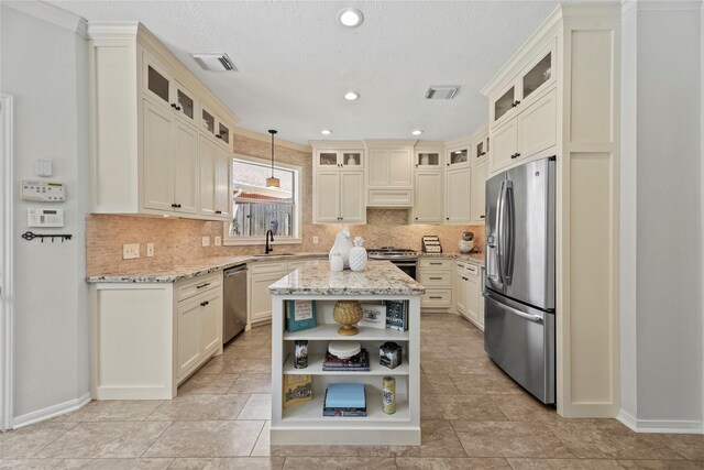 4019 Bellinger Way, Missouri City, TX 77459 - kitchen featuring appliances with stainless steel finishes, open shelves, a sink, tasteful backsplash, and recessed lighting