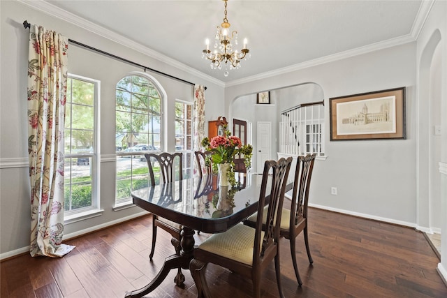 4019 Bellinger Way, Missouri City, TX 77459 - dining room with a chandelier, arched walkways, baseboards, crown molding, and dark wood-style flooring