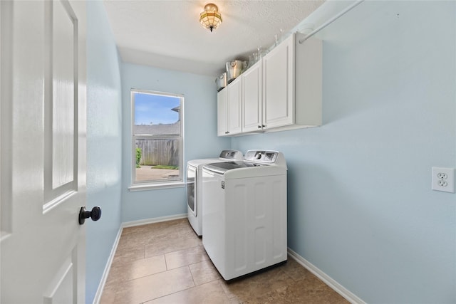 4019 Bellinger Way, Missouri City, TX 77459 - washroom with washing machine and dryer, cabinet space, baseboards, and light tile patterned floors