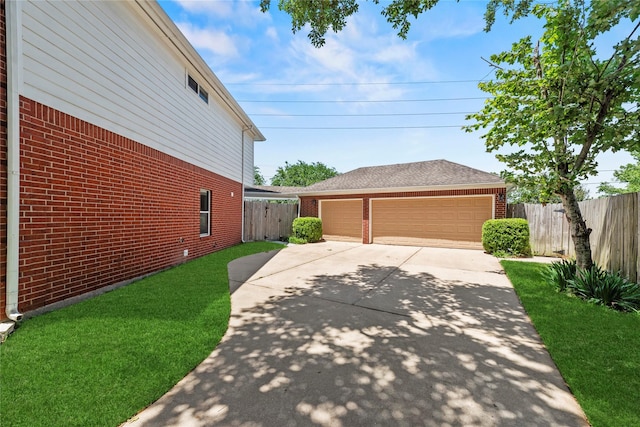 4019 Bellinger Way, Missouri City, TX 77459 - view of property exterior with brick siding and a detached garage