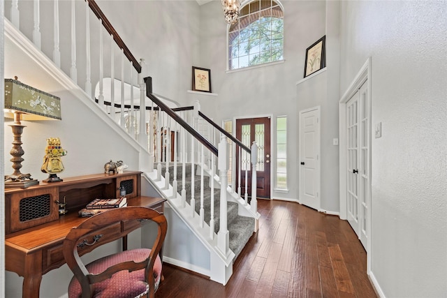 4019 Bellinger Way, Missouri City, TX 77459 - foyer with a towering ceiling, stairway, hardwood / wood-style floors, and baseboards