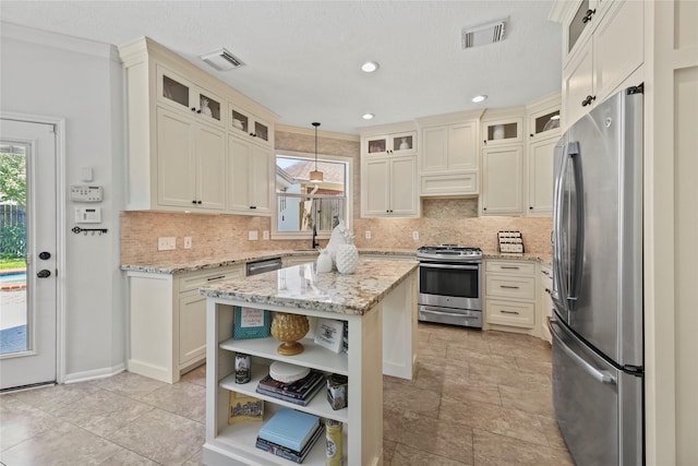 4019 Bellinger Way, Missouri City, TX 77459 - kitchen with appliances with stainless steel finishes, open shelves, decorative backsplash, a kitchen island, and recessed lighting