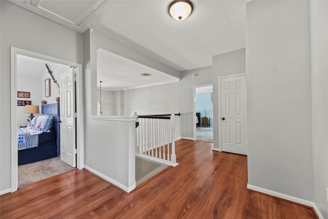 4019 Bellinger Way, Missouri City, TX 77459 - hallway featuring an upstairs landing, wood finished floors, and baseboards