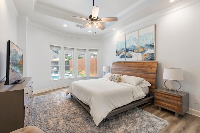 13207 Regency Oak Ln, Cypress, TX 77429 - bedroom featuring ornamental molding, baseboards, recessed lighting, wood finished floors, and ceiling fan