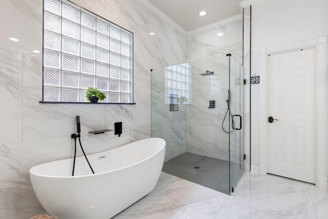 13207 Regency Oak Ln, Cypress, TX 77429 - full bath featuring marble tiled floors, ornamental molding, a marble finish shower, a soaking tub, and tile walls