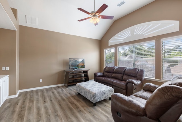 13207 Regency Oak Ln, Cypress, TX 77429 - living area with plenty of natural light, light wood-type flooring, a ceiling fan, high vaulted ceiling, and baseboards