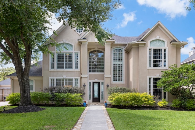 13207 Regency Oak Ln, Cypress, TX 77429 - view of front of home featuring stucco siding and a front yard
