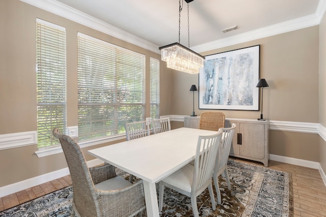 13207 Regency Oak Ln, Cypress, TX 77429 - dining room with a chandelier, ornamental molding, baseboards, and light wood finished floors