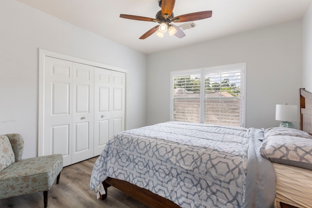 13207 Regency Oak Ln, Cypress, TX 77429 - bedroom with wood finished floors, a closet, and ceiling fan