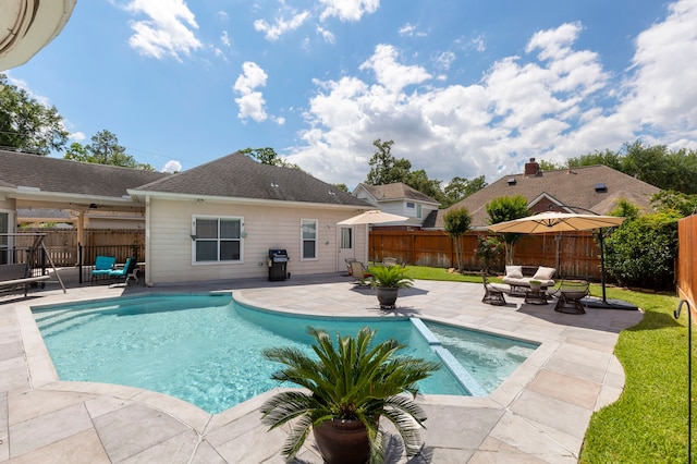 13207 Regency Oak Ln, Cypress, TX 77429 - view of pool featuring a patio area, grilling area, a fenced backyard, and an outdoor living space