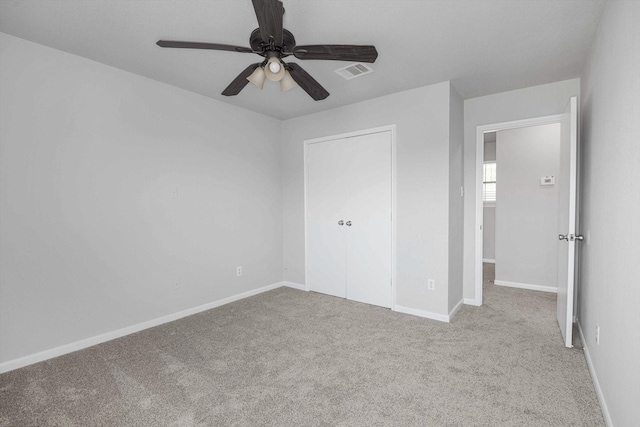 8111 Sanders Forest Ct, Humble, TX 77338 - unfurnished bedroom with carpet flooring, baseboards, and a ceiling fan