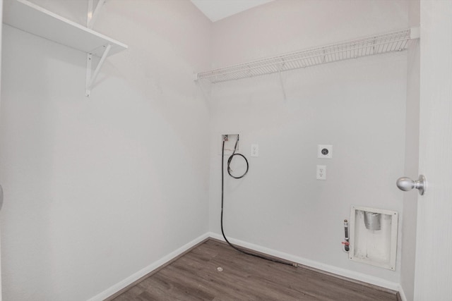 8111 Sanders Forest Ct, Humble, TX 77338 - laundry room with hookup for a washing machine, wood finished floors, electric dryer hookup, baseboards, and hookup for a gas dryer
