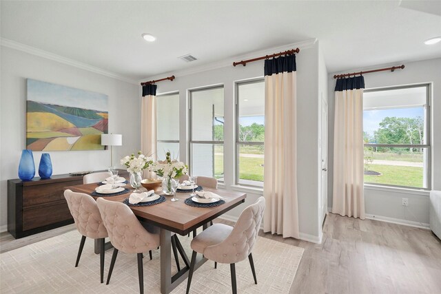 701 Barton Place Dr, Cleveland, TX 77327 - dining space featuring ornamental molding, healthy amount of natural light, light wood finished floors, baseboards, and recessed lighting