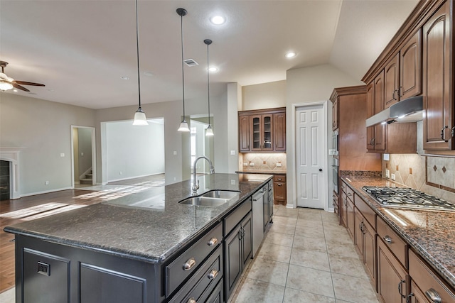18618 Arlan Lake Dr, Spring, TX 77388 - kitchen featuring a sink, under cabinet range hood, appliances with stainless steel finishes, a ceiling fan, and tasteful backsplash