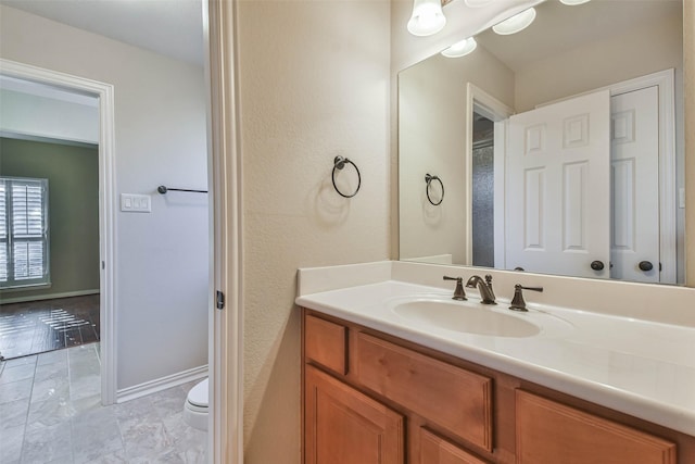 18618 Arlan Lake Dr, Spring, TX 77388 - bathroom featuring vanity, toilet, and a textured wall